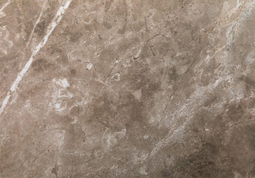 Beige or soft brown abstract texture backdrop with marble stone pattern for kitchen or bathroom countertop or exterior design.